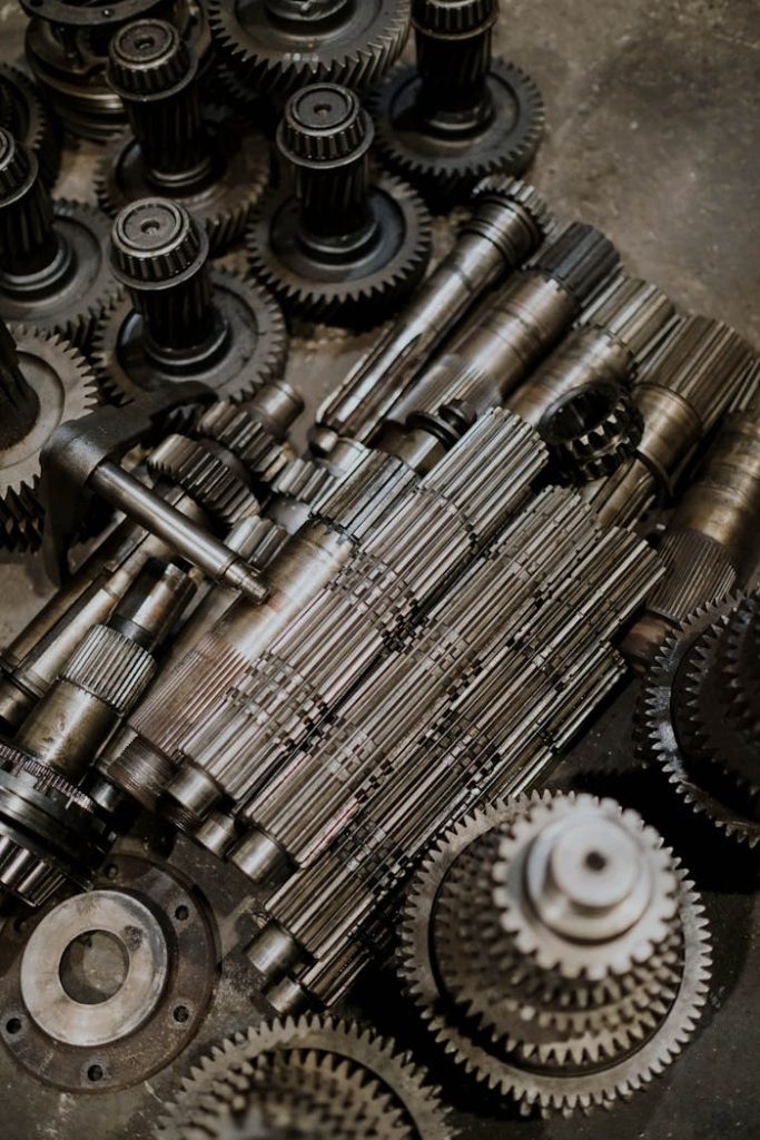 Close-up of metallic cogs and gears showcasing intricate machinery design for industrial use.